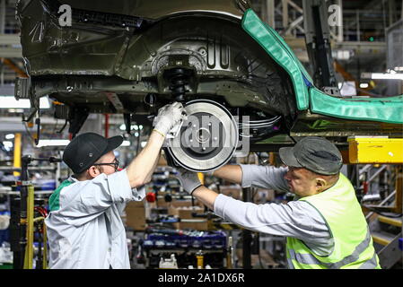 Russia. 24th Sep, 2019. KALUGA REGION, RUSSIA - SEPTEMBER 24, 2019: Workers on a car assembly line at the PCMA Rus car plant in Rosva Industrial Park in Kaluga Region, Russia; the car factory was inaugurated as a joint project by PSA Peugeot Citroen and Mitsubishi Motors Corporation in 2009, currently it has the production capacity of 125,000 vehicles per year and manufactures the Pajero Sport and SUV Outlander for the Mitsubishi Motors Corporation, and a number of vehicles for the PSA Group. Sergei Bobylev/TASS Credit: ITAR-TASS News Agency/Alamy Live News