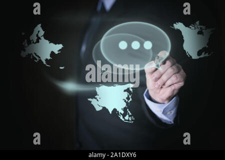 Businessman uses touchscreen, with concept global networking Stock Photo