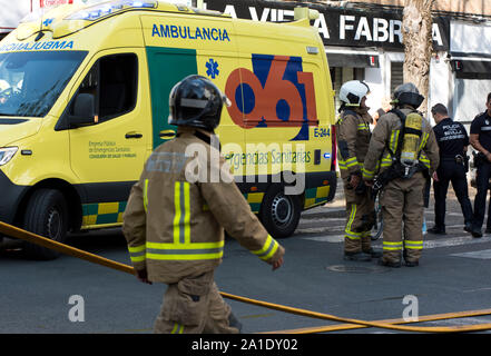 Spanish emergency services, firefighters, police and ambulances respond to an apartment fire in Seville, capital of Andalusia, Spain. Stock Photo