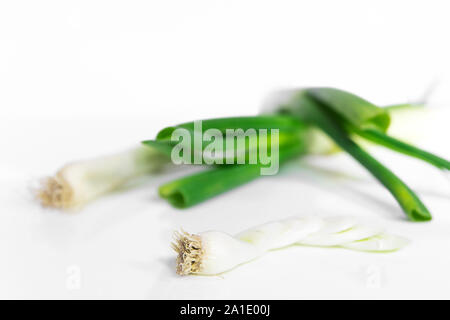 some scallions in front of white background Stock Photo