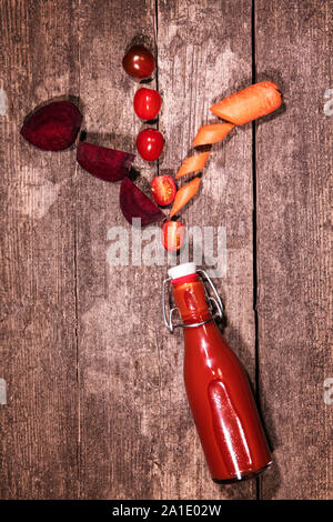 ingredients of a vegetable juice or soup on a rustic wooden background Stock Photo