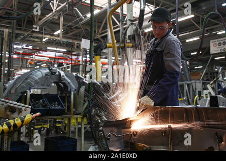 Russia. 24th Sep, 2019. KALUGA REGION, RUSSIA - SEPTEMBER 24, 2019: A worker at the PCMA Rus car plant in Rosva Industrial Park in Kaluga Region, Russia; the car factory was inaugurated as a joint project by PSA Peugeot Citroen and Mitsubishi Motors Corporation in 2009, currently it has the production capacity of 125,000 vehicles per year and manufactures the Pajero Sport and SUV Outlander for the Mitsubishi Motors Corporation, and a number of vehicles for the PSA Group. Sergei Bobylev/TASS Credit: ITAR-TASS News Agency/Alamy Live News