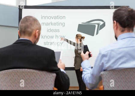 female businesswoman is showing new technology virtual reality Stock Photo