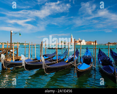 Gondolas and in lagoon of Venice by Saint Mark San Marco square Stock Photo