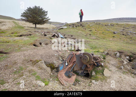 Abandoned remains of a vehicle and scrap metal near the old lead mines on Oxclose Road, Ivy Scar, between Woodhall and Carperby, Yorkshire Dales Natio Stock Photo