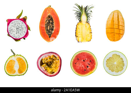 A lot of different tropical fruits cut halves isolated on white. Stock Photo