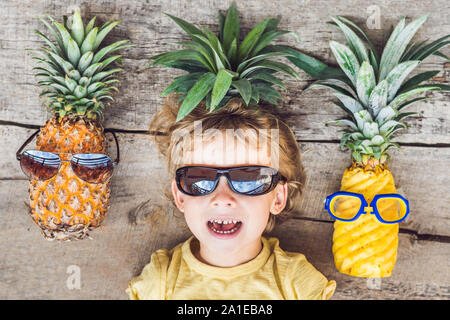 A pineapple boy and pineapples on vacation. Stock Photo