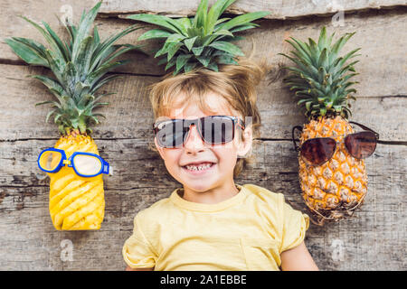 A pineapple boy and pineapples on vacation. Stock Photo