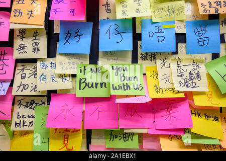 Lennon Wall at City University Hong Kong. September 25  2019.   This is one of many locations that has Lennon Walls containing posters, messages and grafitti that are found around Hong Kong. Stock Photo