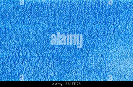 Closeup blue microfiber skin of cleaning mob, as the concept of texture background Stock Photo