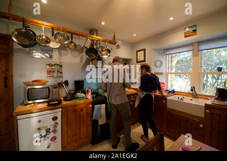 Father and daughter baking in kitchen Stock Photo
