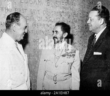 Emperor Haile Selassie I of Ethiopia, standing with Edgar B. Stern and Dr. Albert W. Dent (Former President of Dillard University). 1954. Stock Photo