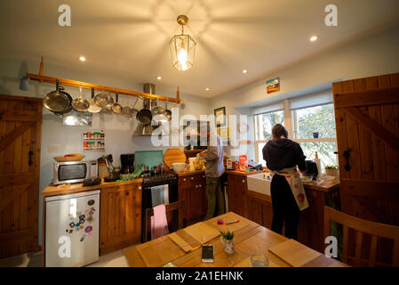 Father and daughter baking in kitchen Stock Photo