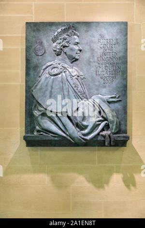Commemorative stone plaque of Queen Elizabeth II, on a wall at the Supreme Court of the United Kingdom, London, UK