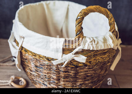 Wicker straw basket made of recycled materials. grocery mesh string eco bag.  sustainable shopping and home. recycled material gifts. eucaliptus leaves  Stock Photo - Alamy