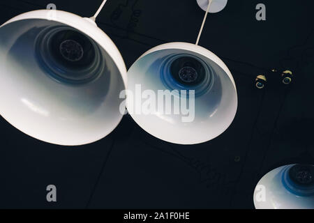 Close up of industrial style lamps decorated in a modern coffee shop. Royalty high quality free stock image of lamps. Stock Photo