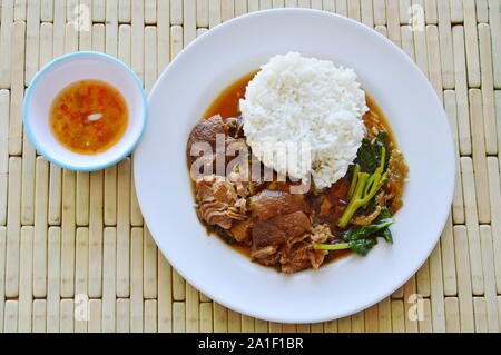 pork leg stewed with rice on dish Stock Photo