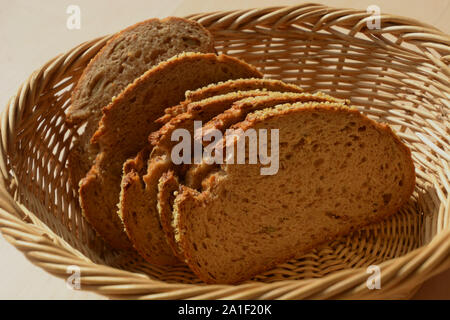slices of emmer wheat bread in breakfast basket, chrunchy and healthy grain hulled wheat loaf Stock Photo