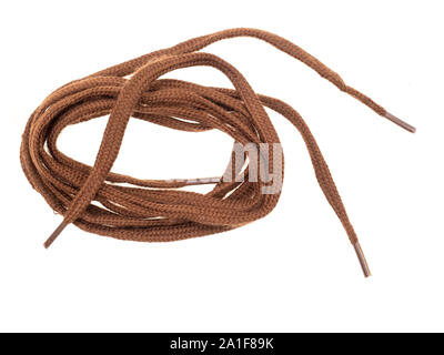 Pair of classic flat brown shoe laces isolated on white background. Stock Photo