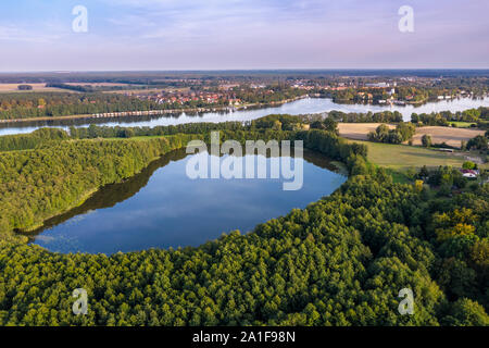 Drone shot, aerial view over  lake Schulzensee to lake Mirow, castle Mirow on island back right, Mecklenburg lake district, Mecklenburg-Vorpommern, Ge Stock Photo