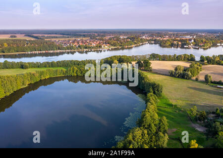 Drone shot, aerial view over  lake Schulzensee to lake Mirow, castle Mirow on island back right, Mecklenburg lake district, Mecklenburg-Vorpommern, Ge Stock Photo