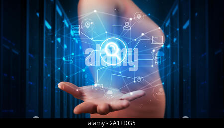 Man holding hologram projection displaying cloud technology symbols Stock Photo