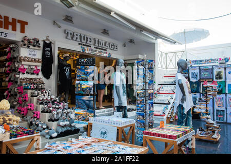 SANTORINI, GREECE - APRIL, 2018: Stores at Perissa beach in Santorini Island Stock Photo