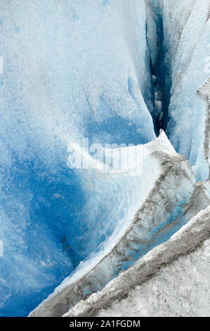 Spiky ice formations on the surface of the Perito Moreno glacier with its deep blue color and the dirty Stock Photo