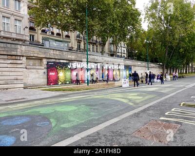 People participating in an activity to promote community involvement in environmental sustainability, Quai Anatole France, Paris, France. Stock Photo