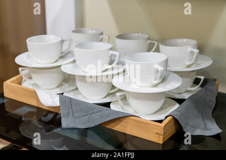 Group of empty cups, in many rows of white cup for service tea or coffee in breakfast or buffet and seminar event Stock Photo