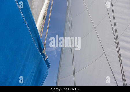 Sails in the wind. Mast and rigging on a sailing boat Stock Photo