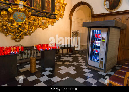 Candle vending machine in church Stock Photo