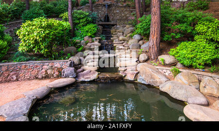 Cascading fountain with a stones in landscape design Stock Photo