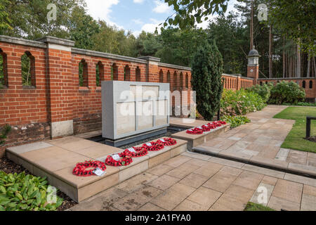 Woking Muslim Burial Ground and Peace Garden, historic war cemetery in Surrey, UK. The war memorial with poppy wreaths.