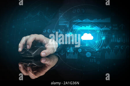Hand using wireless mouse with cloud technology concept and dark background Stock Photo