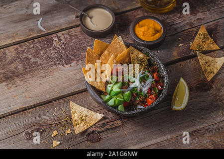 Traditional Arabic fattoush salad with fried flat bread, copy space. Stock Photo