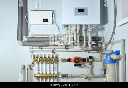 Pump with a thermometer for a water underfloor heating system at home. Servo, sensors and temperature control. Heating systems, installation of water Stock Photo