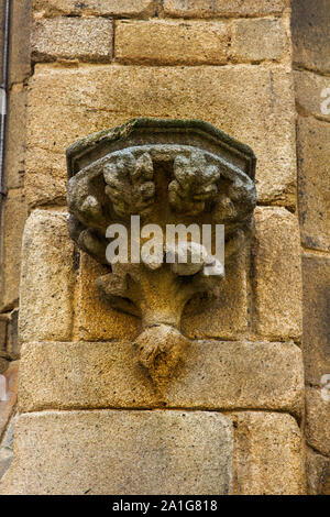 stone urn in ancient Cathedral. Architectural details on building, aesthetic frills. Stock Photo