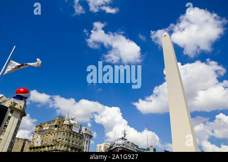 BUENOS AIRES - SEP 12: Obelisco on September 12, 2012 in Buenos Aires. Located at the junction of Avenida 9 de Julio and Corrientes Street. Its name h Stock Photo