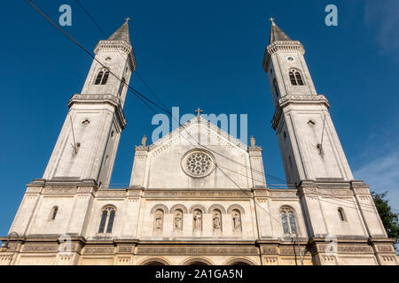 The twin towers of Ludwigskirche (The Catholic Parish and University Church St. Louis) , a neo-romanesque church in Munich, Bavaria, Germany. Stock Photo