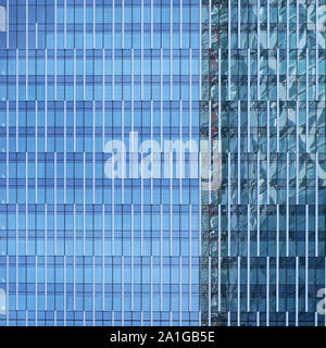 Windows on modern glass and steel skyscraper building - abstract business background Stock Photo