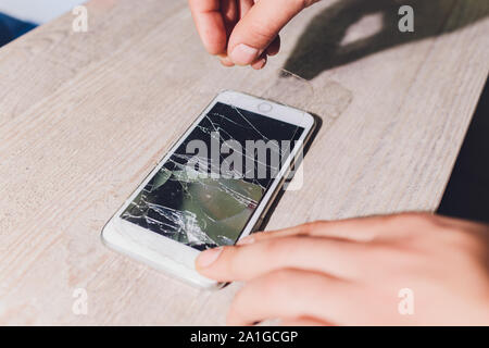 Closeup of severley cracked smashed smart phone Stock Photo