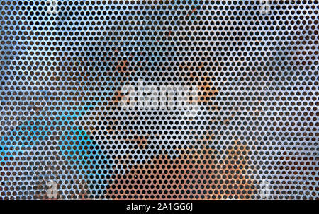 Perforated metal sheet as background. Clean against dirty facade symbol. Stock Photo