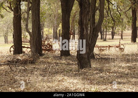 Very old rusted farming equipment like agricultural field cultivator from the turn of the century Stock Photo