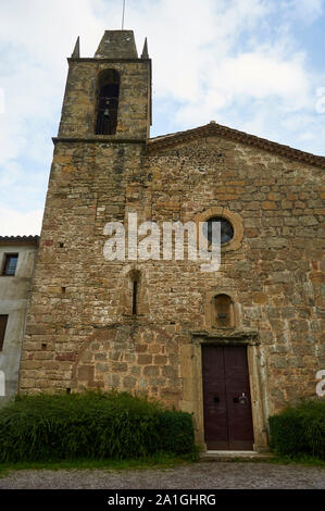 Facade and bell tower of Sant Miquel de Sacot romanesque church in Garrotxa Volcanic Zone Natural Park (Santa Pau, La Garrocha, Girona, Spain) Stock Photo
