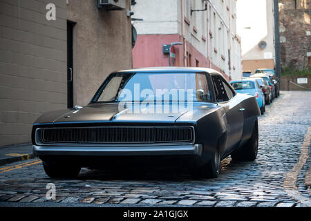 A Dodge Charger on the streets of Edinburgh during the filming of Fast and Furious 9 in September 2019. Taken at Stevenlaw's Close along Cowgate. Stock Photo