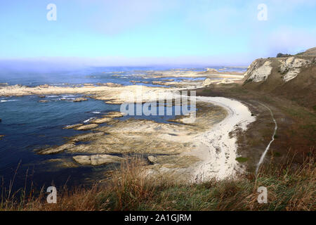 Kaikoura landscape, Canterbury, New Zealand: Beautiful coastline, rocky foreground, the view across a seal colony Stock Photo