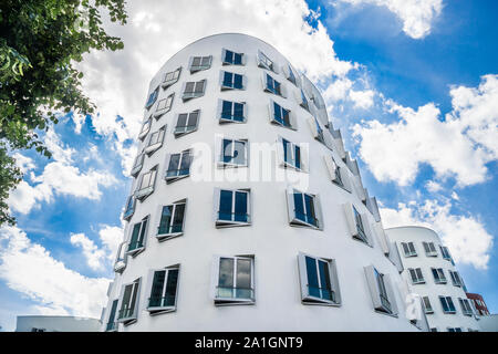 the twisting and spiraling shapes of the postmodern Gehry buildings at Media Harbour, Port of Düsseldorf, North Rhine-Westphalia, Germany Stock Photo