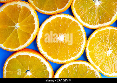 Several orange slides close to each other on a blue background Stock Photo