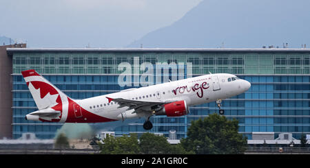 Richmond, British Columbia, Canada. 21st Sep, 2019. An Air Canada Rouge Airbus A319 (C-GBIN) single-aisle jet airliner takes off from Vancouver International Airport. Credit: Bayne Stanley/ZUMA Wire/Alamy Live News Stock Photo